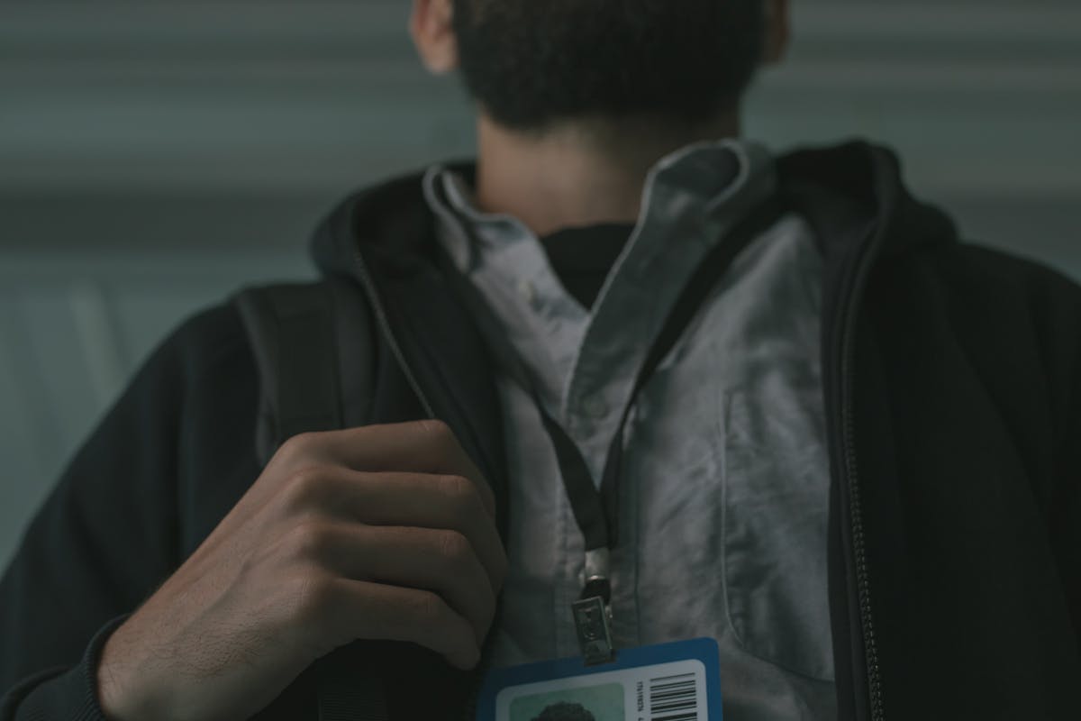 Security officer with ID badge and lanyard — lanyards vs uniforms vs plain clothes comparison